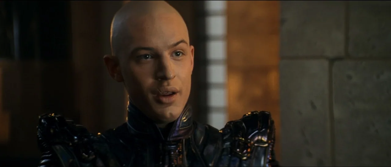 Star Trek: Nemesis (2002) movie still: medium — An interior space with textured stone-like walls and artificial light sources in the background. A…