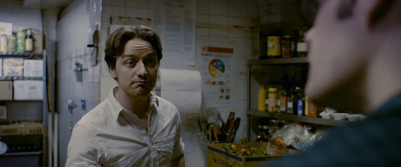 The Disappearance of Eleanor Rigby: Him (2014) movie still: medium — A cramped restaurant kitchen features wire shelving units filled with various…