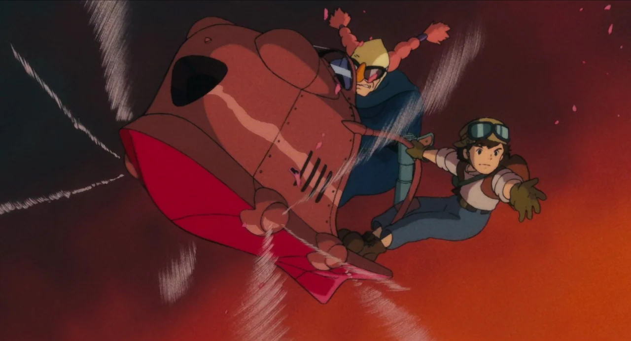 Castle in the Sky (1986) movie still: medium — A high-altitude flight scene set against a twilight-toned red and dark orange horizon. Two…