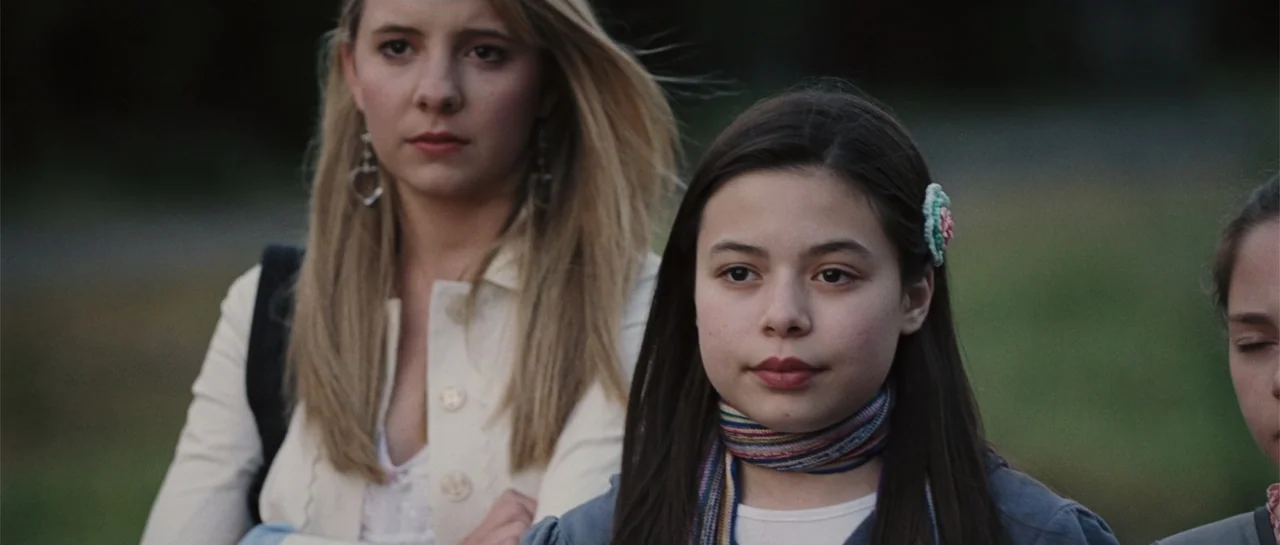 Yours, Mine & Ours (2005) movie still: medium — An outdoor area with blurred green foliage in the background during golden hour. Two young females…