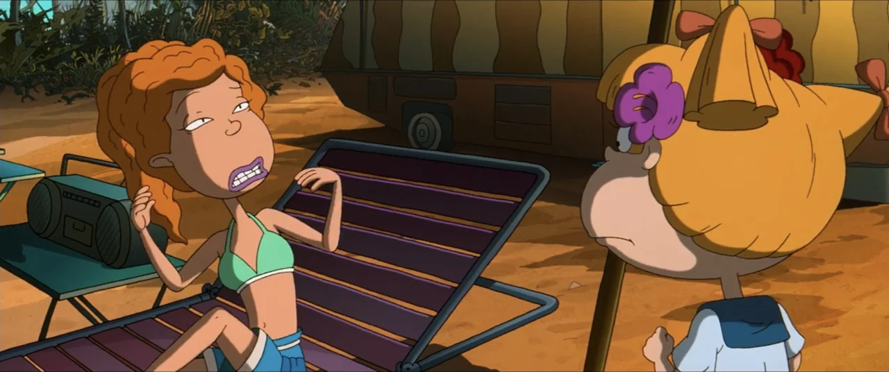 Rugrats Go Wild (2003) movie still: medium — A sunny campsite area features a lounge chair and a small table with a radio. A woman with red hair…