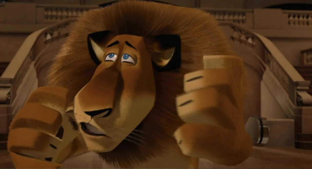 Madagascar (2005) movie still: closeup — A spacious interior terminal with stone architectural details and a large sweeping staircase. An…