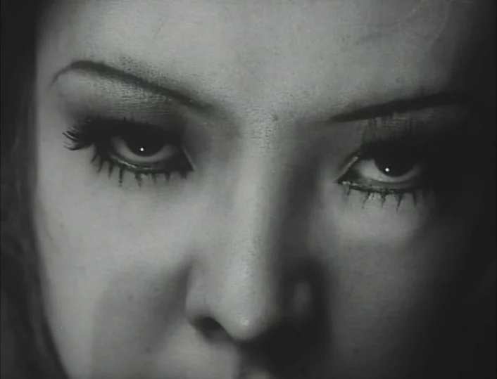 Funeral Parade of Roses (1969) movie still: closeup — A close-up frame shows only the upper portion of a woman's face. The subject stares ahead with…