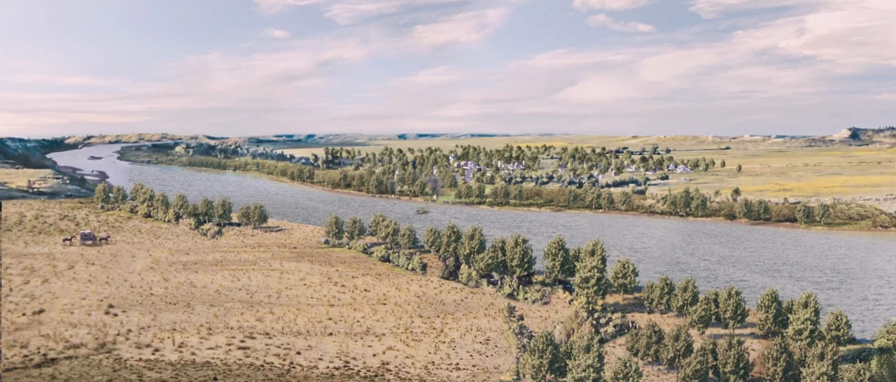 The Homesman (2014) movie still: establishing — A wide, expansive river valley stretches under a broad sky with sparse clouds. A small settlement…