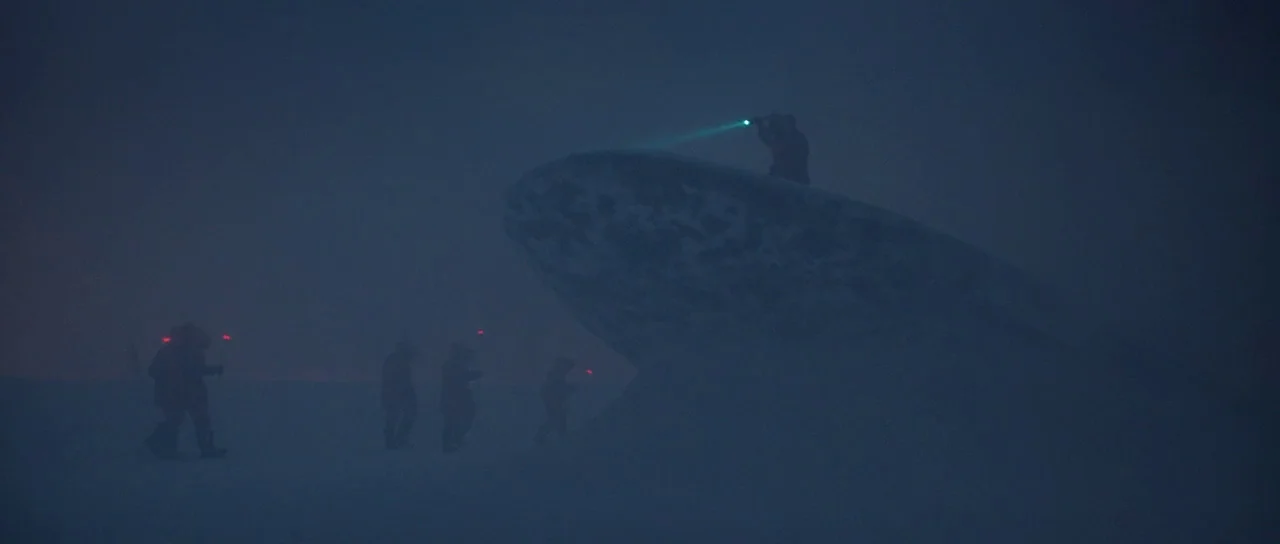 Captain America: The First Avenger (2011) movie still: wide — A group of figures navigates a vast, snow-covered landscape under low visibility…