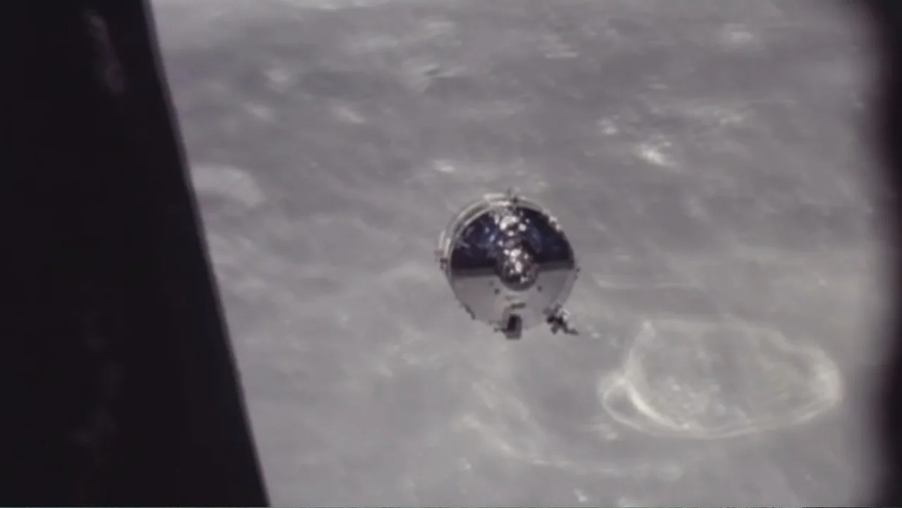 UFO Conspiracies: The Hidden Truth (2020) movie still: wide — A metallic Apollo command module drifts through space above the grey, pockmarked lunar…