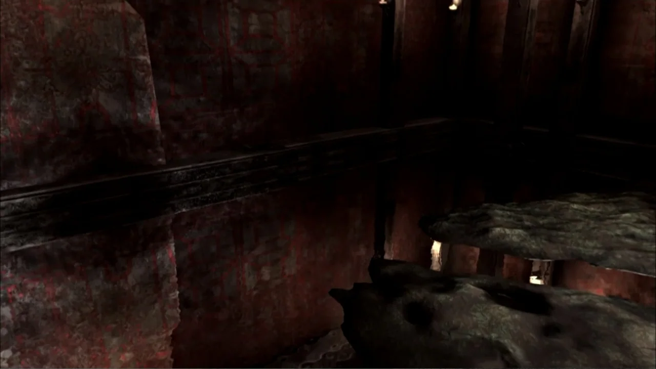The First Emperor (2006) movie still: establishing — A dark stone interior featuring layered rock formations and weathered walls with red etchings.…
