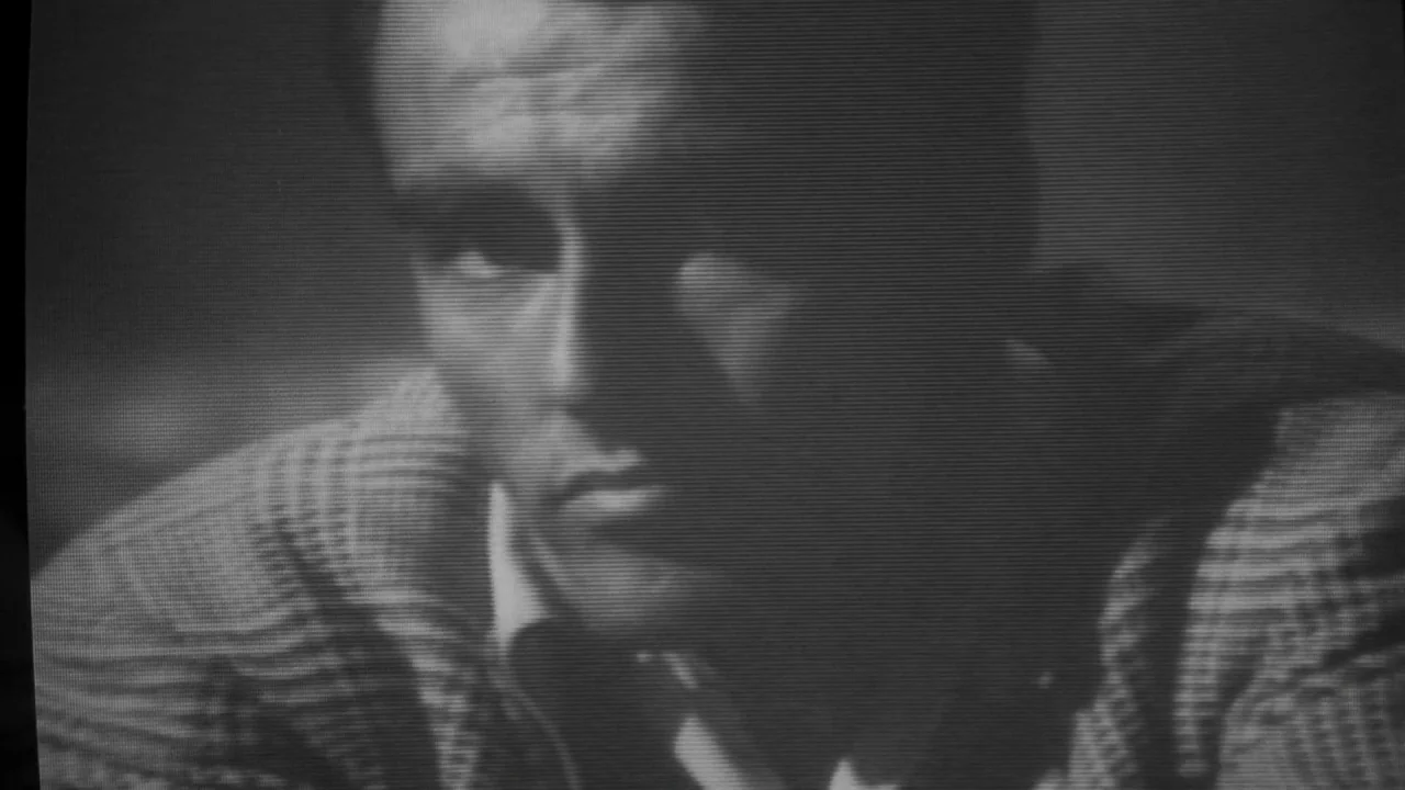 Friday the 13th: A New Beginning (1985) movie still: closeup — A close-up shot captured with heavy television signal scan lines and black-and-white…