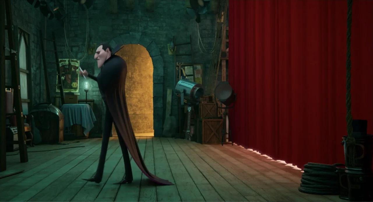 Hotel Transylvania: Transformania (2022) movie still: fullbody — A stone-walled backstage area features wooden flooring, ladders, and a heavy red…