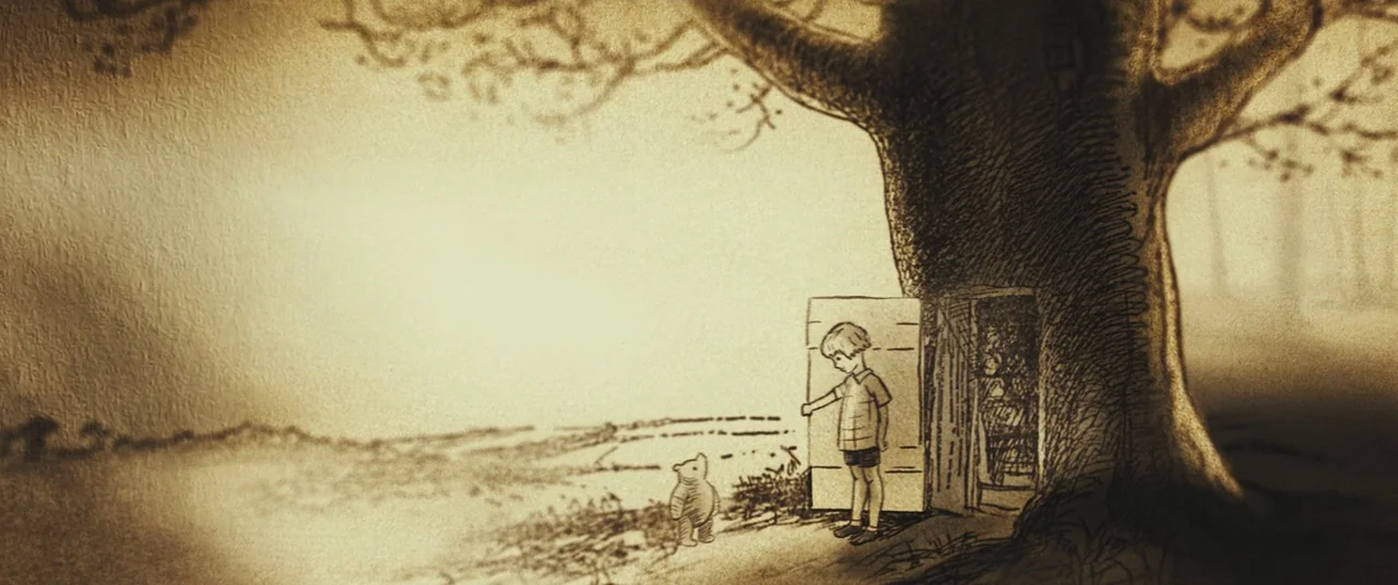 Christopher Robin (2018) movie still: wide — An illustrated woodland scene features a large, gnarled tree with a wooden door set. A young boy…