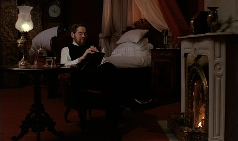 Cries and Whispers (1972) movie still: medium — An early 20th-century room with a fireplace, canopy bed, and antique furniture. A bearded man in…