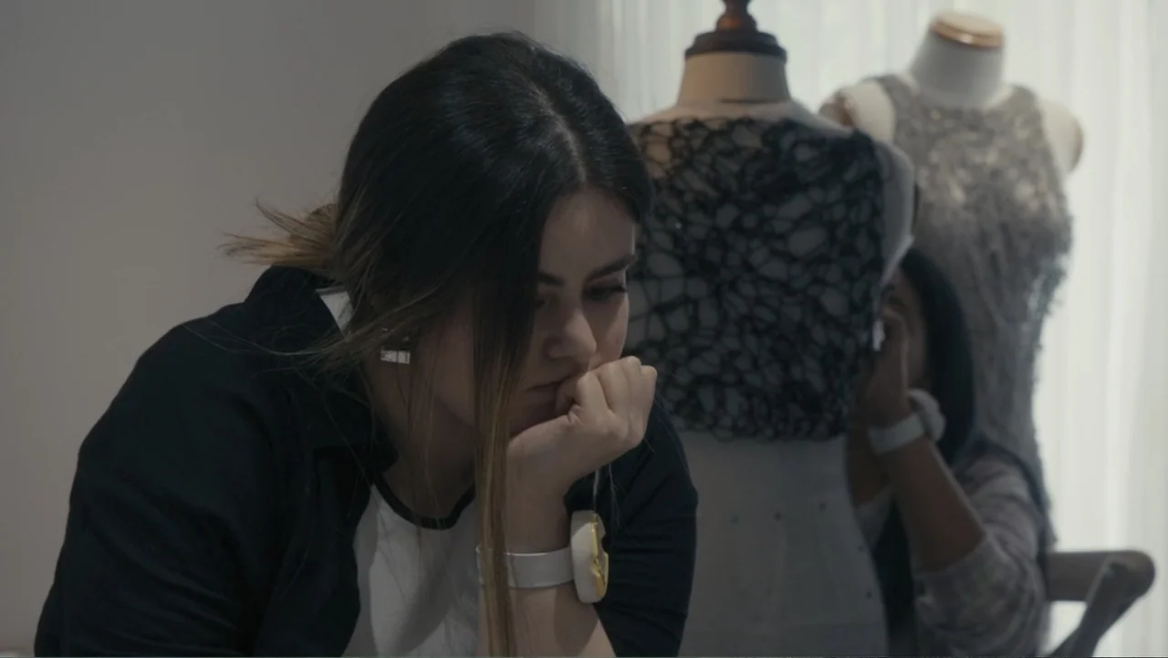 Victoria's Secret: The Tour '23 (2023) movie still: closeup — A light-filled workspace contains two white mannequins draped in detailed textile…