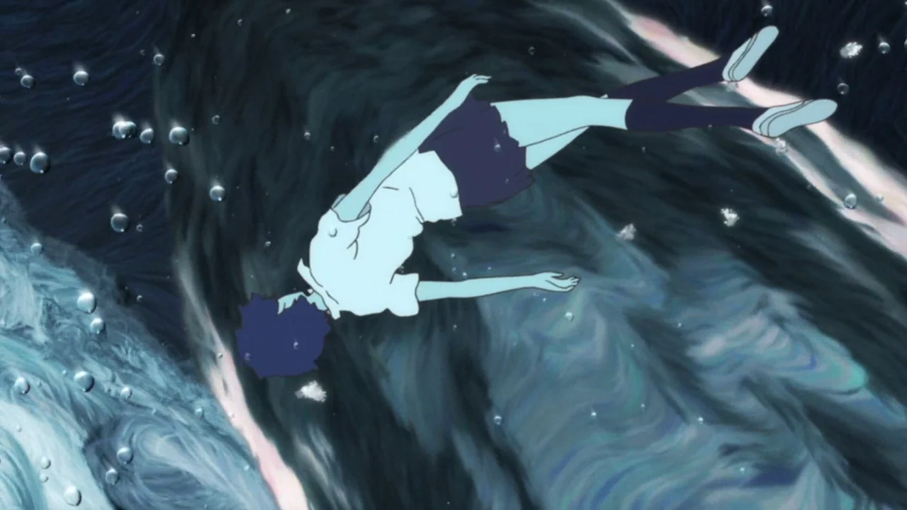 The Girl Who Leapt Through Time (2006) movie still: fullbody — A person floats in dark, swirling underwater depths surrounded by rising air bubbles.…