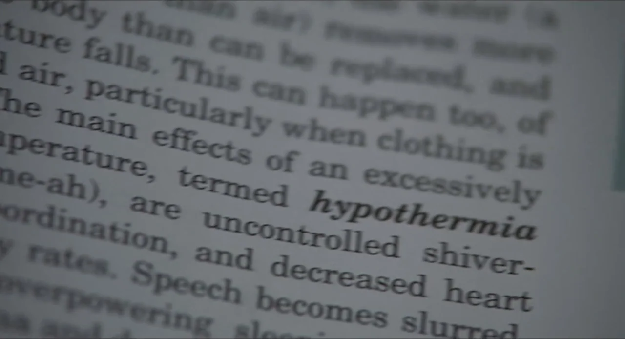 The Ring Two (2005) movie still: closeup — A close-up view shows a page from a book with printed text in serif font. The word hypothermia is printed…