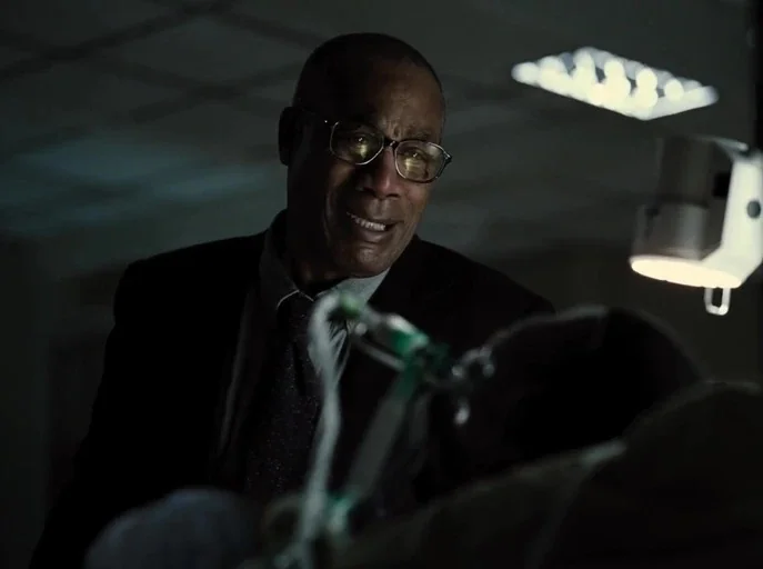 Zack Snyder's Justice League (2021) movie still: closeup — A dark room with medical equipment suggests a hospital environment during the night…