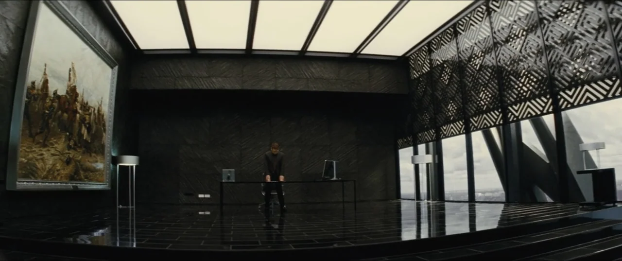 Jack Ryan: Shadow Recruit (2014) movie still: wide — A spacious high-rise office features black textured walls, a glossy dark floor, and windows. A…