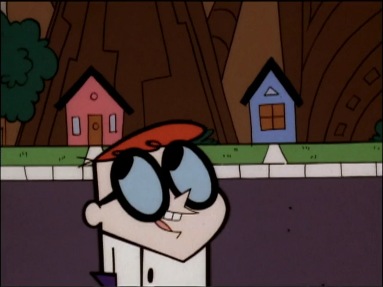 Dexter's Laboratory: Ego Trip (1999) movie still: medium — A cartoon suburban street features stylized houses and a sidewalk under a clear sky. A…