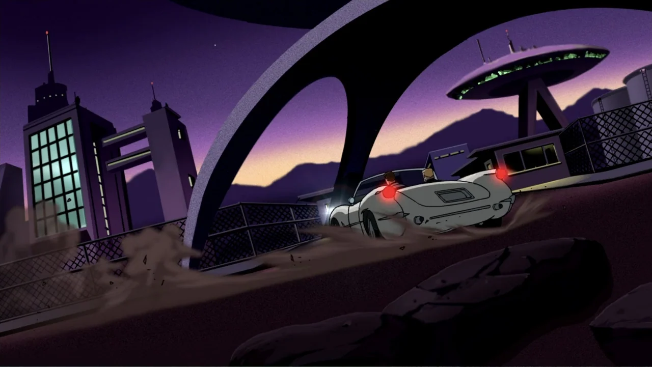 Justice League: The New Frontier (2008) movie still: wide — A stylized city at dusk features a large concrete overpass and modern buildings. Two men…