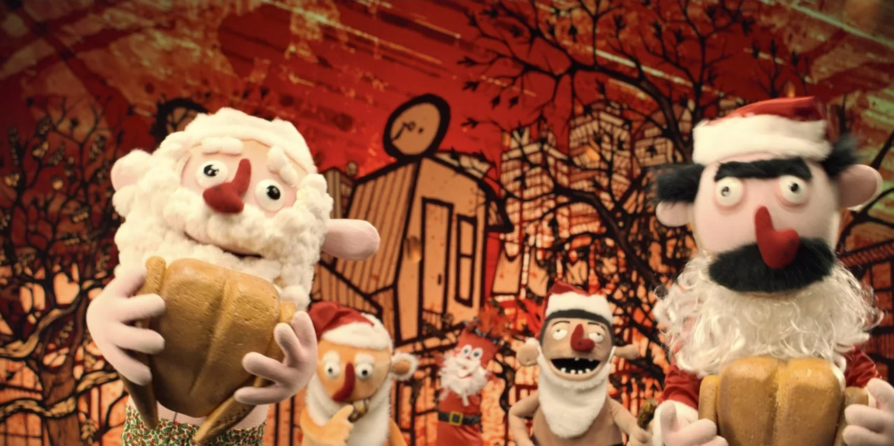 31 Minutes: One Hot Christmas (2025) movie still: medium — A group of Santa-themed puppets stand in front of a stylized, illustrated urban…