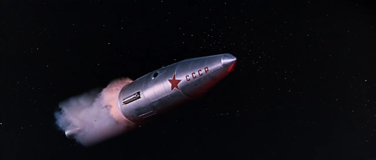 You Only Live Twice (1967) movie still: wide — A silver rocket ship with a red Soviet star and CCCP label floats in space. The craft propels itself…