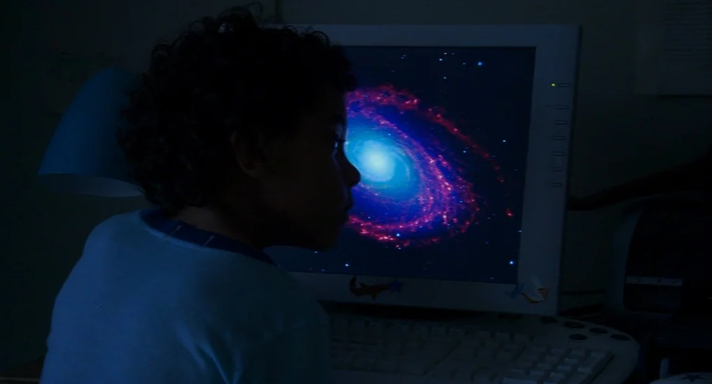 Me and You and Everyone We Know (2005) movie still: medium — A dark, dimly lit study features a computer monitor as the primary light source. A…