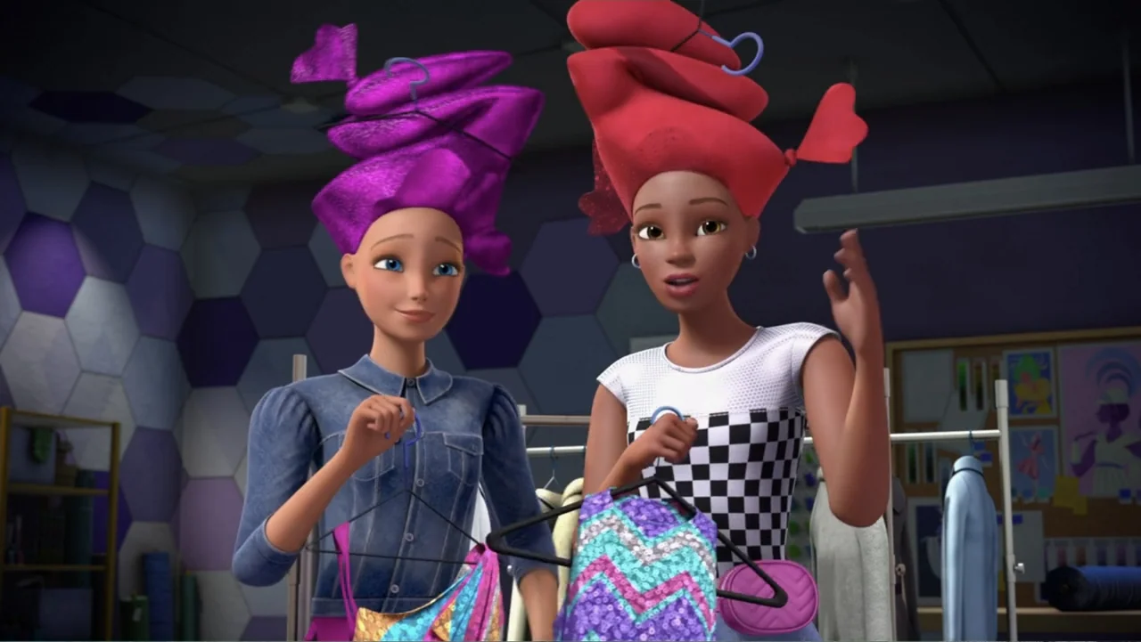 Barbie: Big City, Big Dreams (2021) movie still: medium — A well-lit studio workspace features a patterned hexagonal wall and racks of hanging…