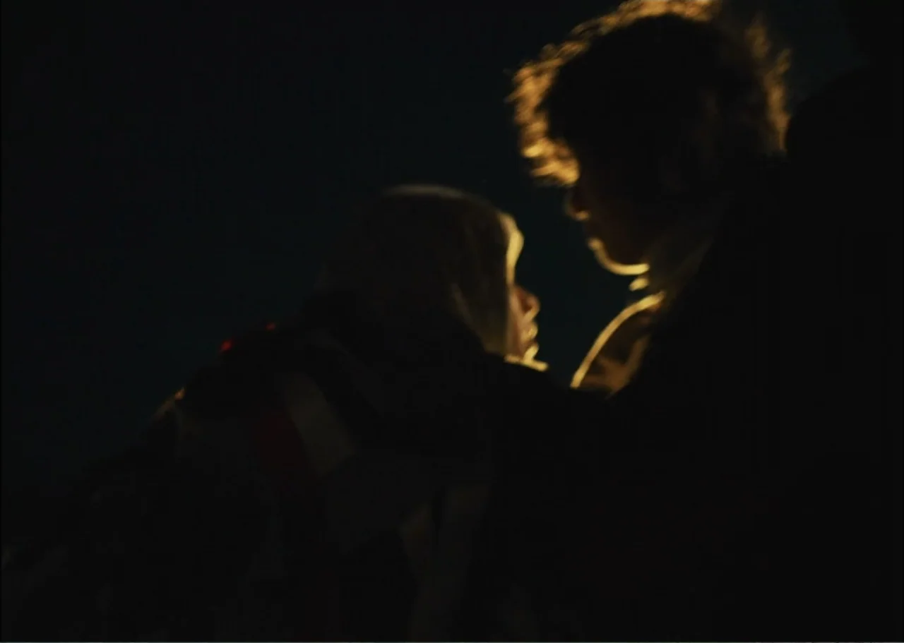 A Fisherman's Tale (1976) movie still: medium — Two figures face each other in an underexposed, dark environment with minimal background detail. The…