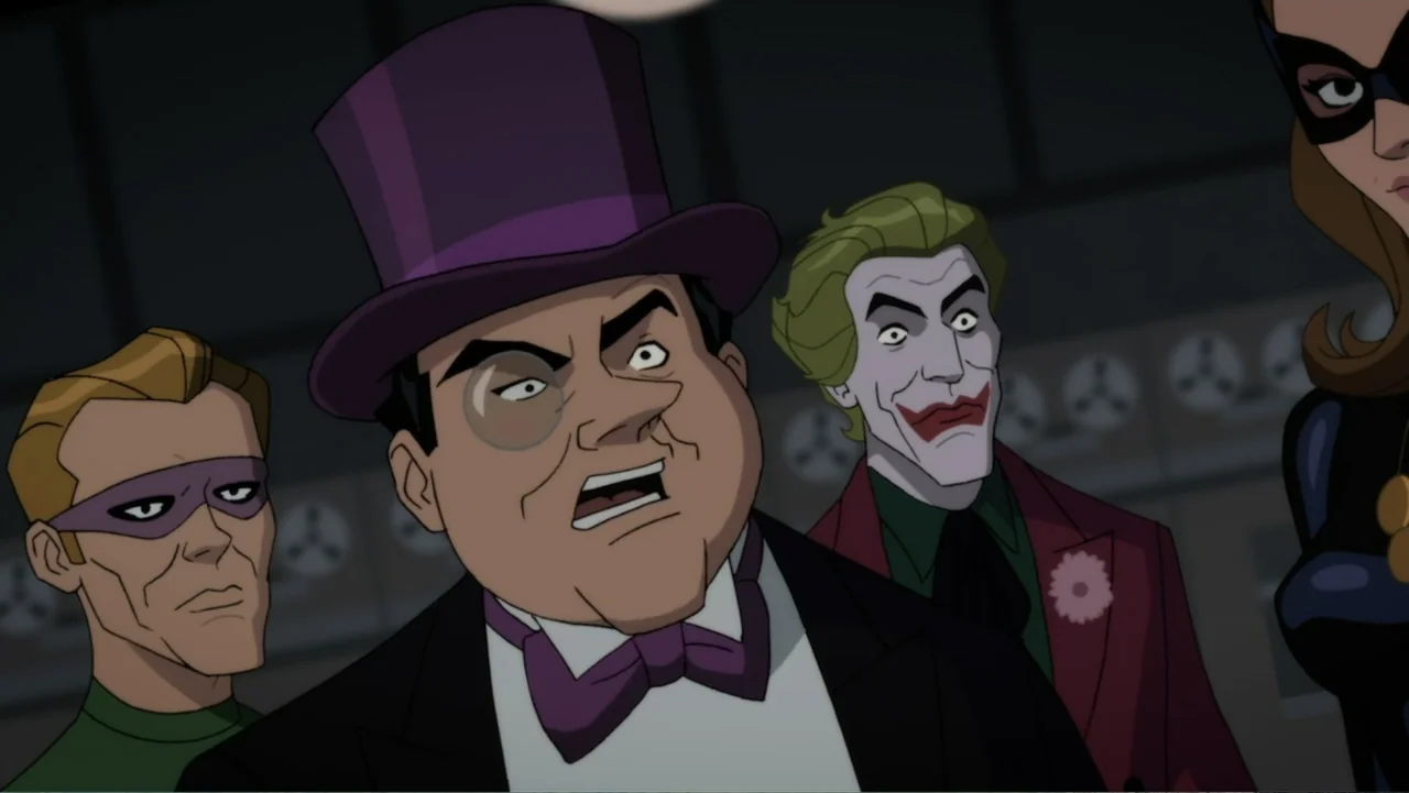 Batman: Return of the Caped Crusaders (2016) movie still: medium — A dark, industrial room features various electronic equipment and shadowy…
