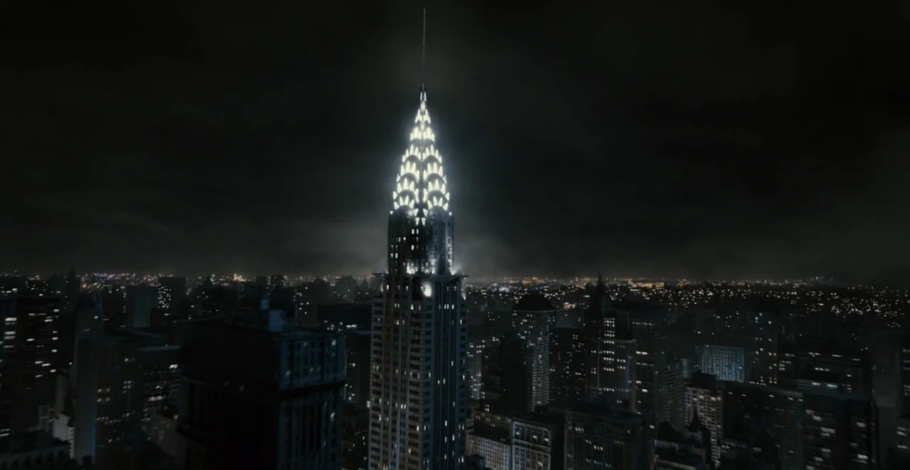Men in Black 3 (2012) movie still: establishing — The Chrysler Building rises above a dense New York City grid at night. Thousands of lit windows…
