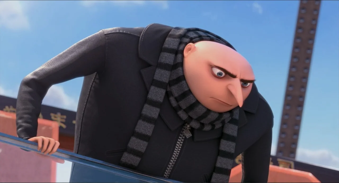 Despicable Me 2 (2013) movie still: medium — A character stands on a balcony against a bright blue sky background. The man leans forward over the…