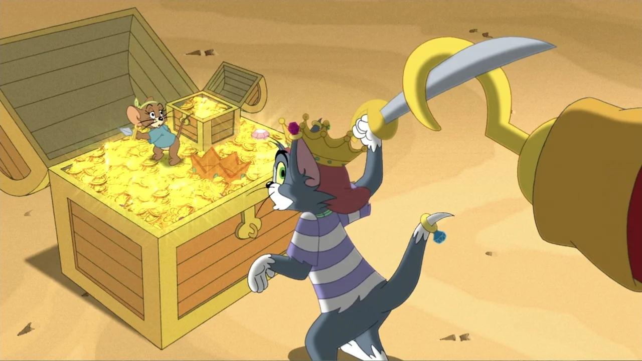 Tom and Jerry: Shiver Me Whiskers (2006) movie still: medium — A sandy beach features a large open wooden treasure chest overflowing with gold…
