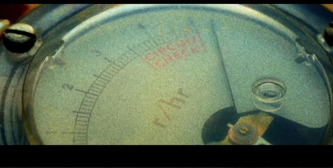 Alien Abduction: Travis Walton (2022) movie still: closeup — A close-up of a circular radiation meter gauge features analog measurements under…