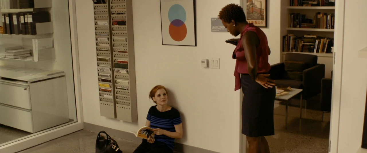 The Disappearance of Eleanor Rigby: Her (2014) movie still: wide — An academic hallway features off-white walls adorned with a geometric poster and…