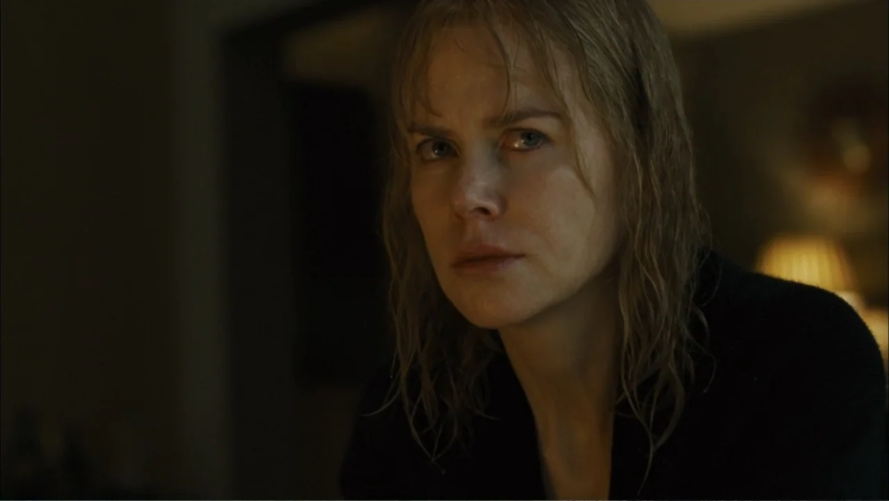 Before I Go to Sleep (2014) movie still: closeup — A dimly lit room interior with dark shadows obscures most of the background surroundings. A…