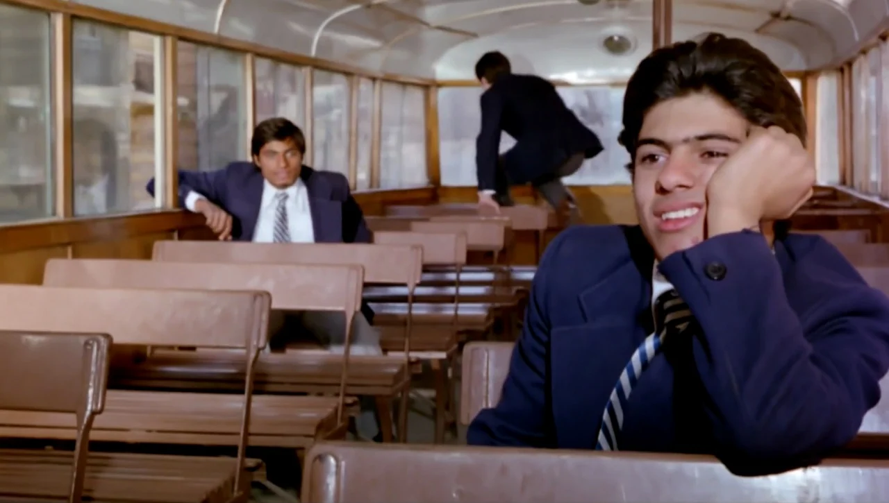Alexandria…Why? (1979) movie still: medium — The interior of a vintage bus with brown wooden bench seats and large windows. A teenager sits in the…