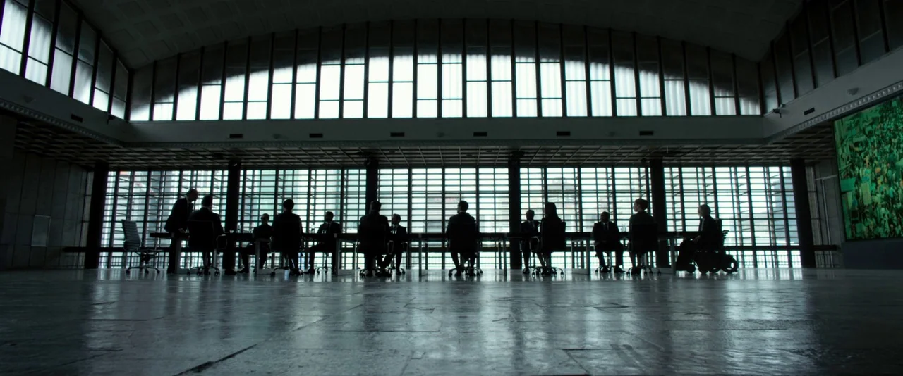 Resident Evil: The Final Chapter (2016) movie still: wide — A spacious, minimalist room features floor-to-ceiling windows and reflective, polished…