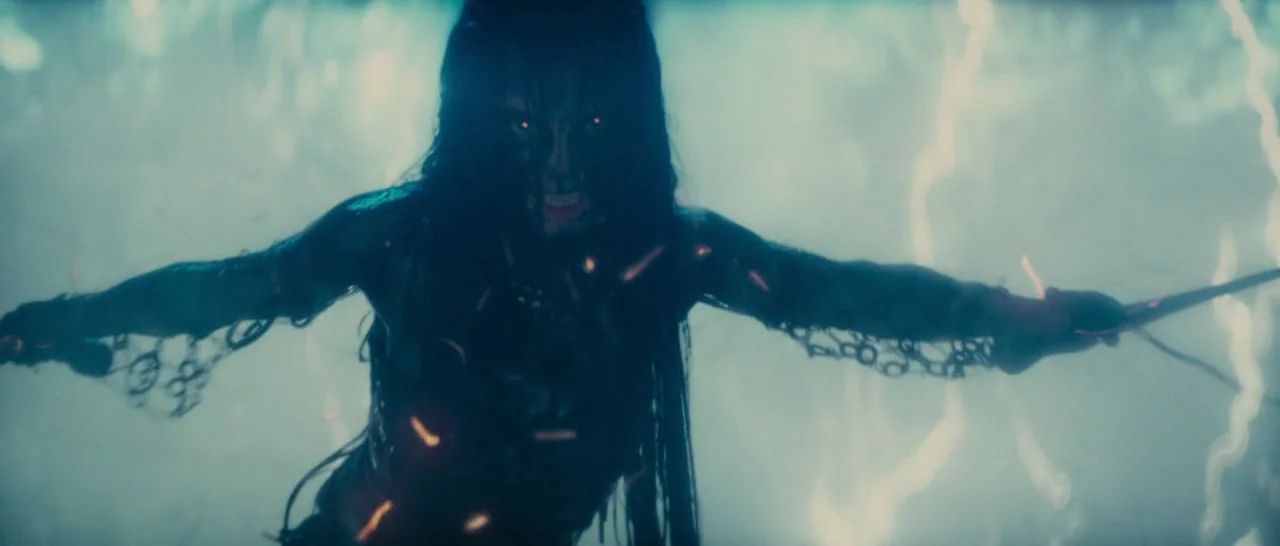 Suicide Squad (2016) movie still: medium — A stormy, dark void filled with atmospheric haze and crackling electrical discharges. A woman with dark…