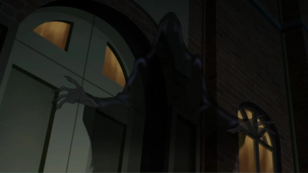 Justice League Dark (2017) movie still: medium — A dark, shadow-like entity stands before the entrance of a brick building at night. The figure…