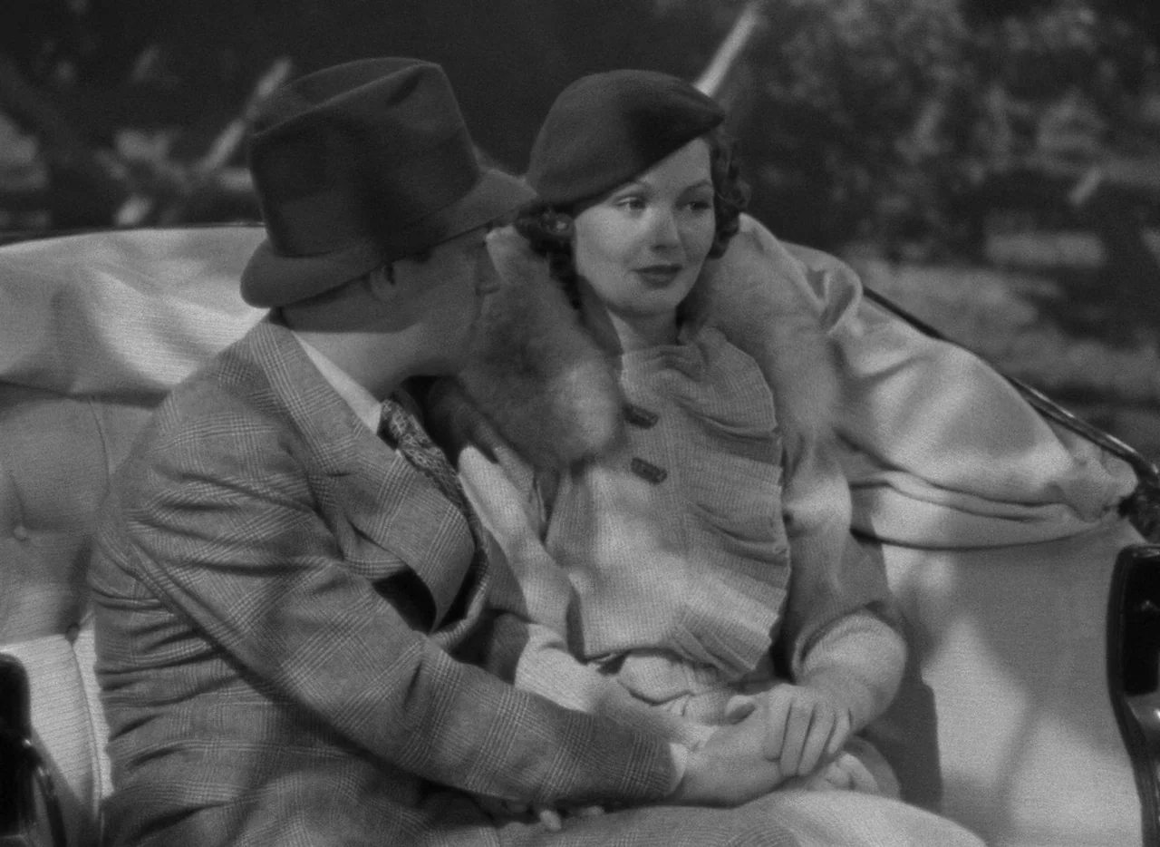 Mark of the Vampire (1935) movie still: medium — A man and woman sit side by side in the plush upholstered seat of a carriage. They hold each…