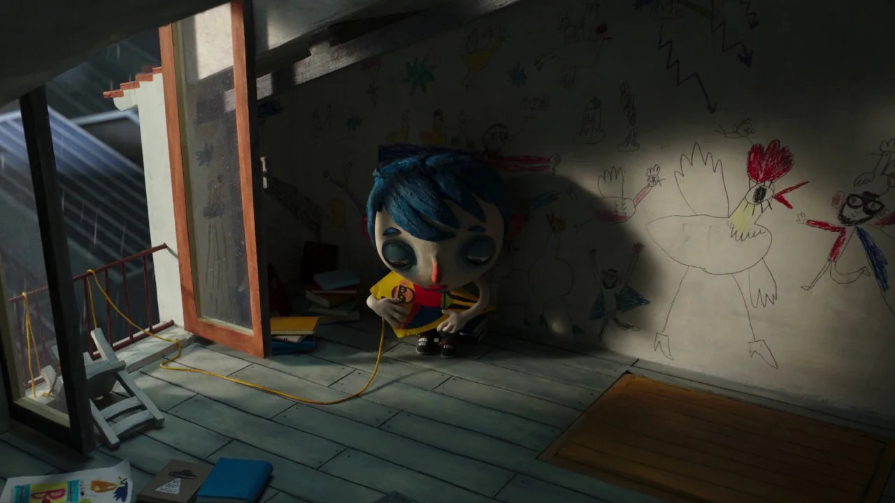 My Life as a Zucchini (2016) movie still: wide — An attic room features wooden floorboards and walls covered with crude marker drawings. A small…