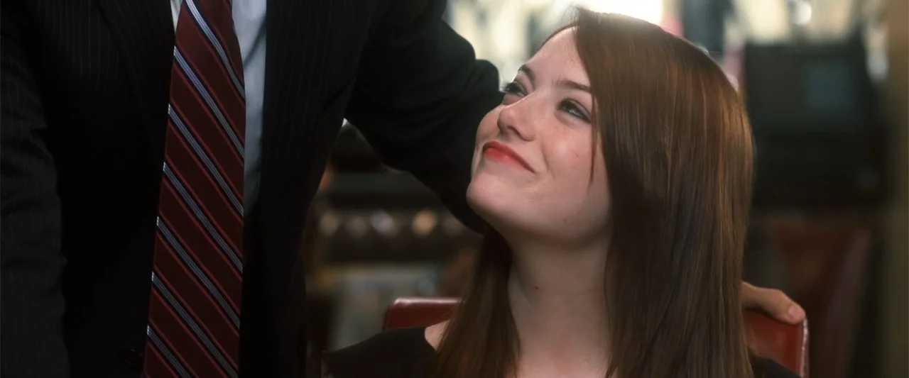 Crazy, Stupid, Love. (2011) movie still: medium — A woman sits in a dark booth while looking at a man standing nearby. She gazes up at him with a…