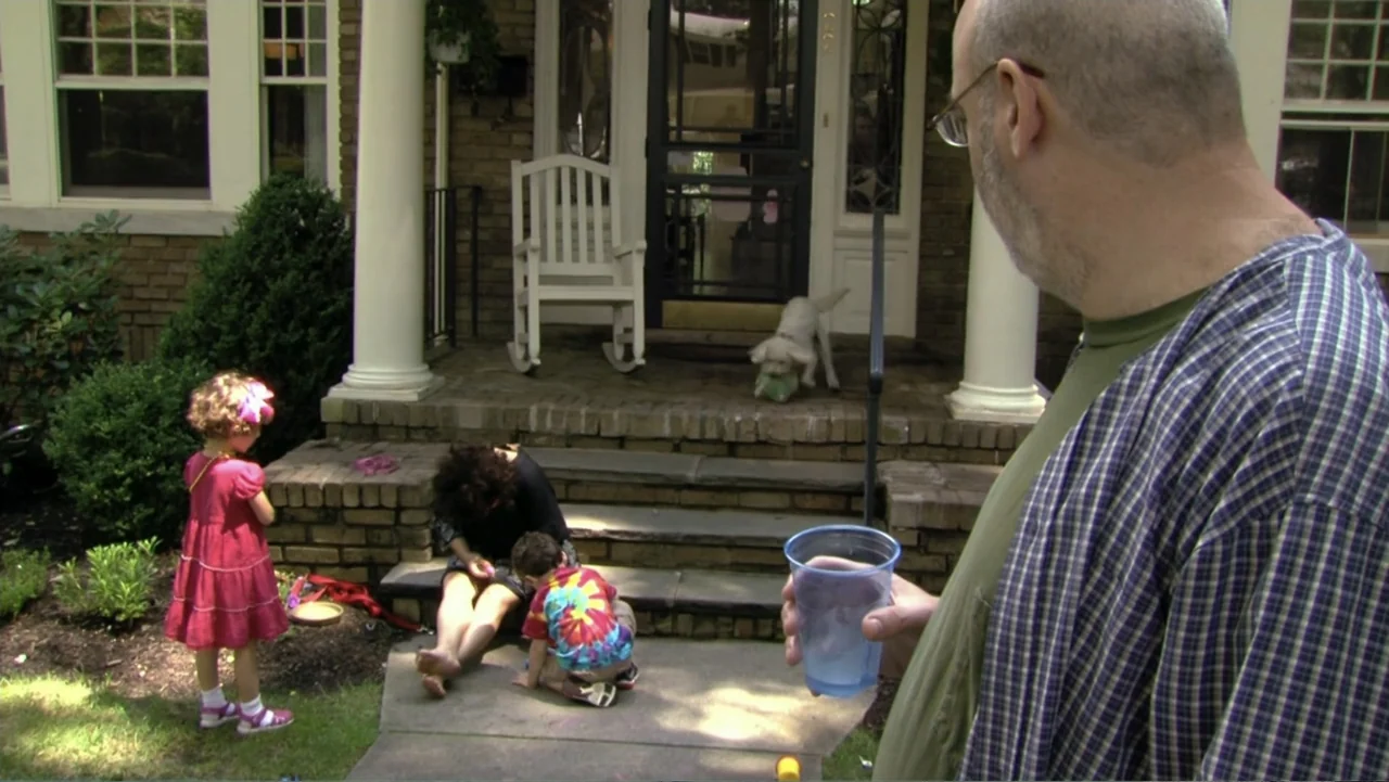 When Strangers Click: Five Stories from the Internet (2011) movie still: medium — A residential front porch features brick steps and a white wooden…