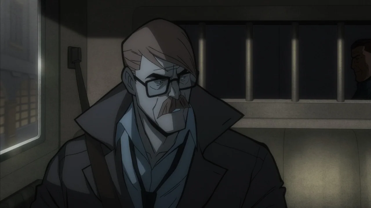 Batman: The Long Halloween, Part Two (2021) movie still: medium — A dark interior of a police vehicle featuring metal bars against a window. A man…