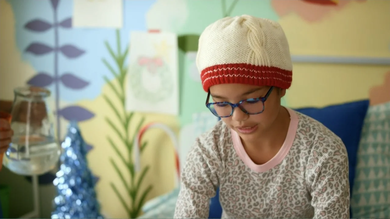 Christmas with a Prince (2018) movie still: medium — A child's bedroom features hand-painted wall decorations and festive holiday accents in the…