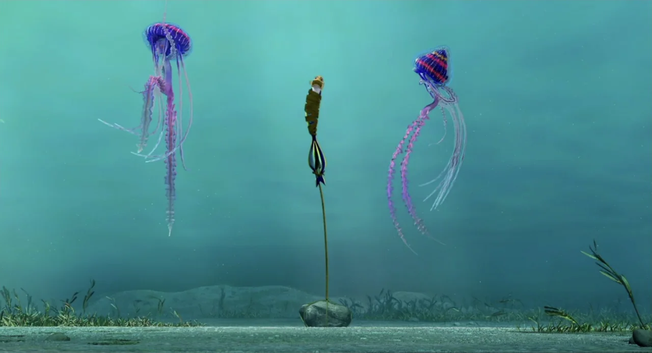 Shark Tale (2004) movie still: wide — An underwater scene displays a sandy floor with sparse aquatic vegetation in the background. Two large…