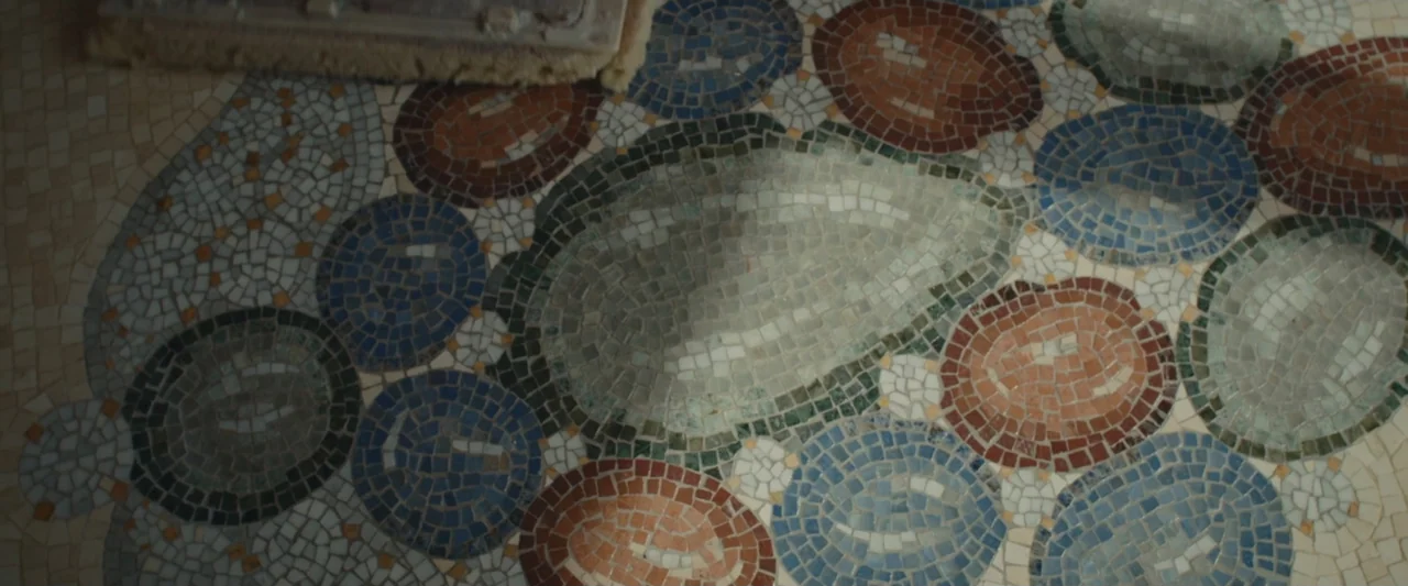 An emperor's jewel - The making of the Bulgari Hotel Roma (2024) movie still: closeup — A close view of a multi-colored stone mosaic floor with…