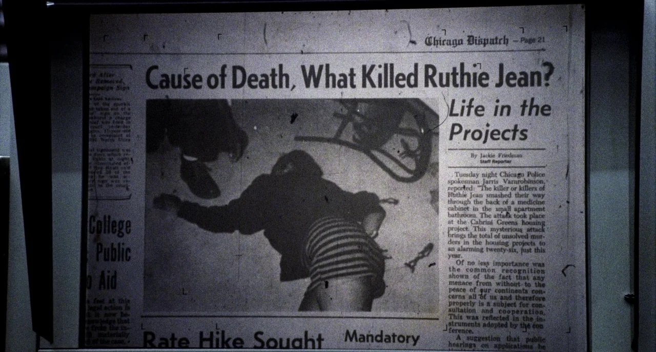 Candyman (1992) movie still: closeup — A close-up view of a newspaper page featuring a story about a crime. The article headline asks about the…