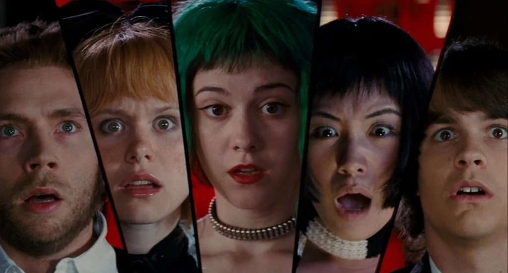 Scott Pilgrim Vs The World (2010) movie still: closeup — Five portrait panels are displayed side-by-side against a vibrant red backdrop. Each…