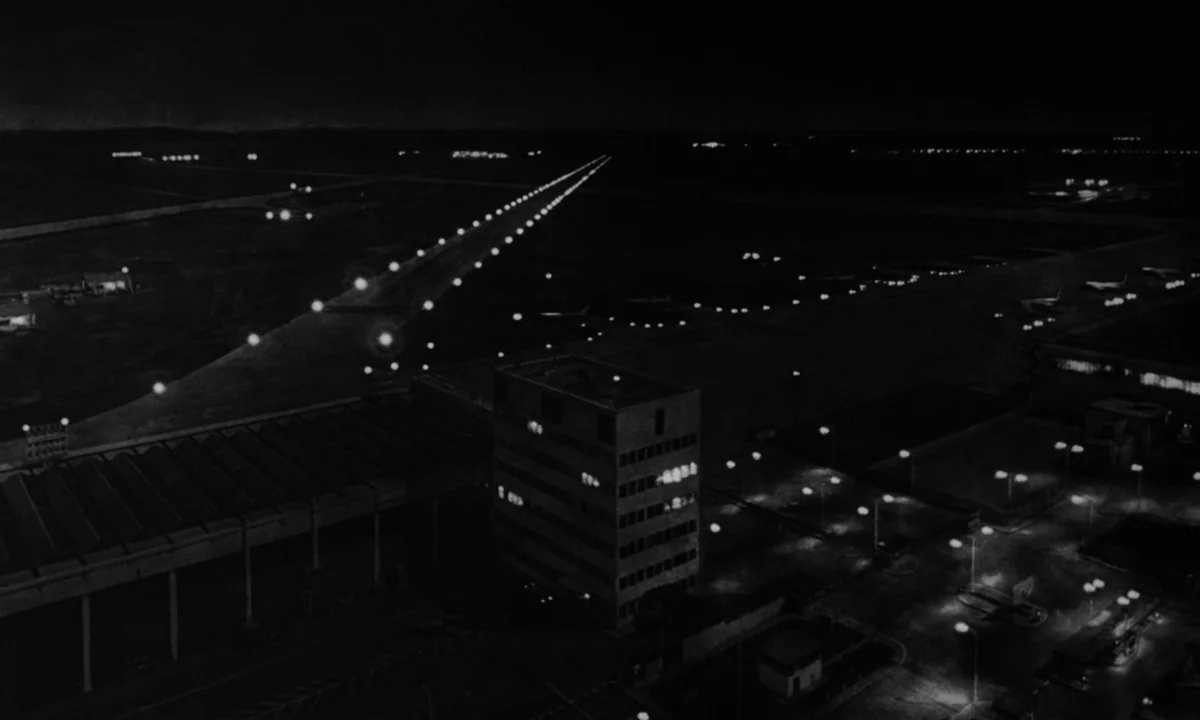 Dr. Strangelove or: How I Learned to Stop Worrying and Love the Bomb (1964) movie still: establishing — An aerial night view of an airport tarmac…
