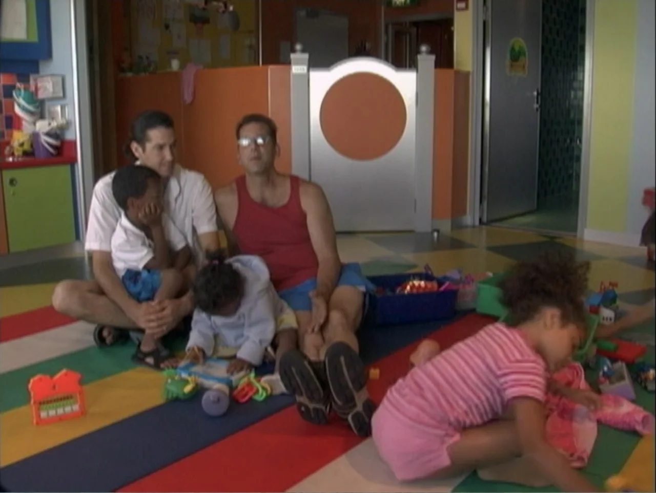 All Aboard! Rosie's Family Cruise (2006) movie still: medium — A vibrant indoor play area features colorful floor mats and orange partition walls.…